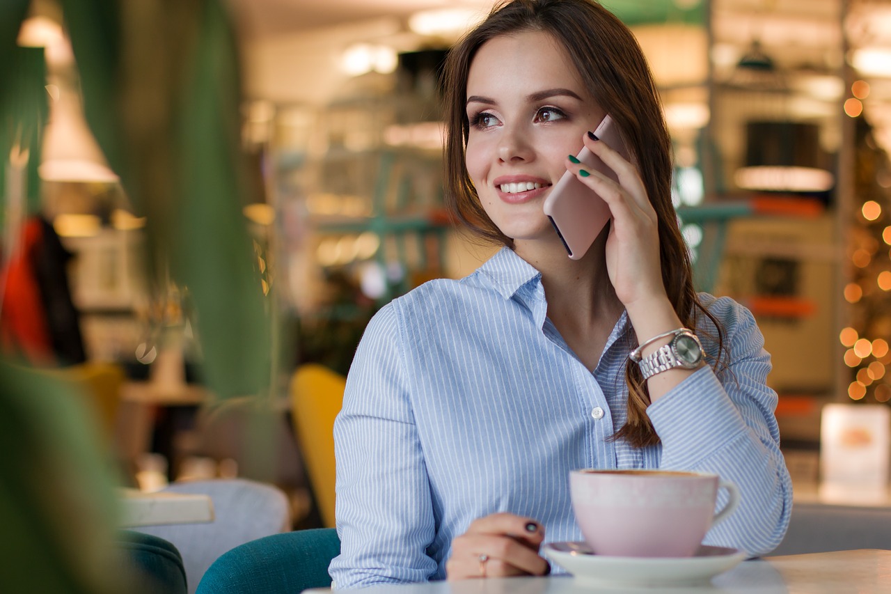 woman on phone in restaurant, mobile smartphone