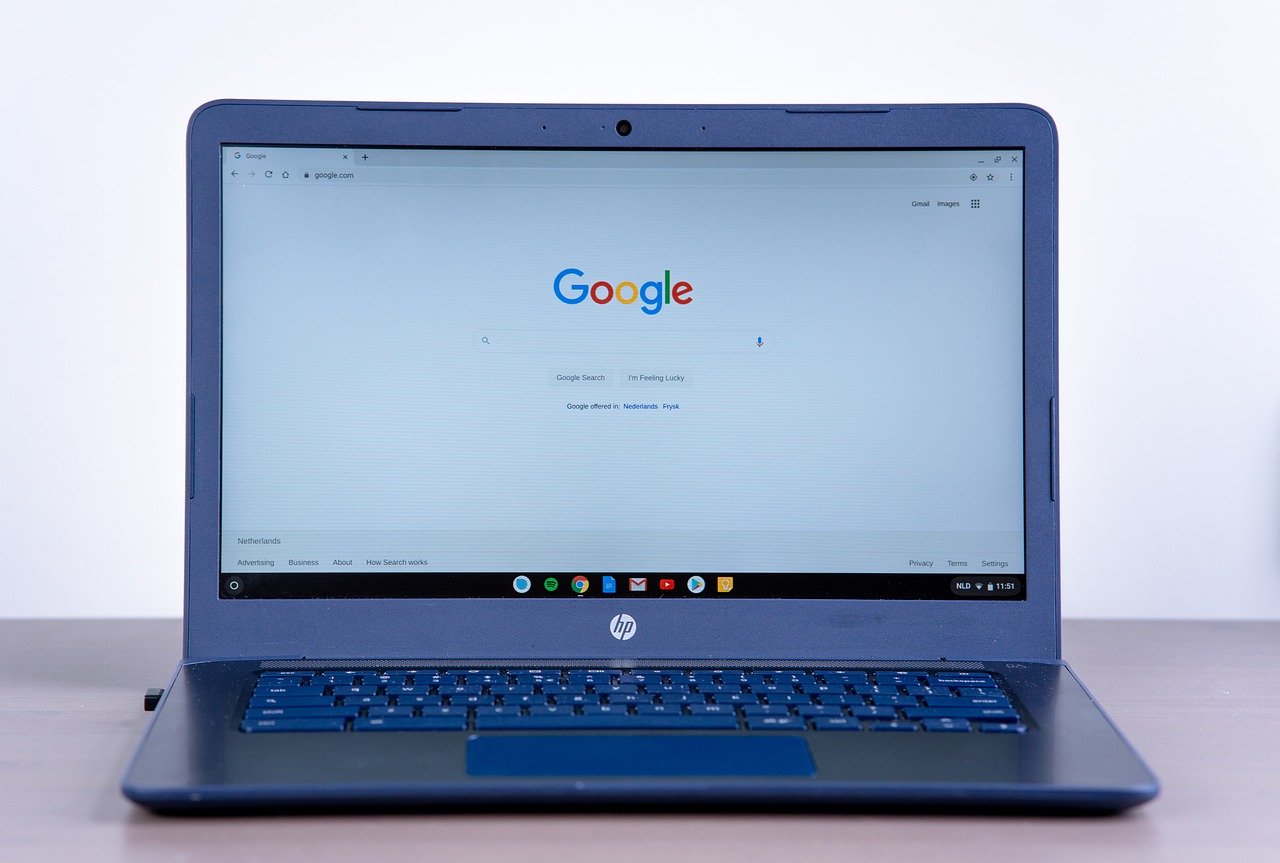 A black HP Chromebook sitting on a table