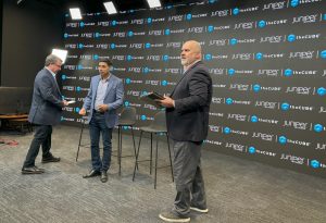 TheCUBE’s John Furrier and Bob Laliberte on set with Juniper Networks’ Praveen Jain.