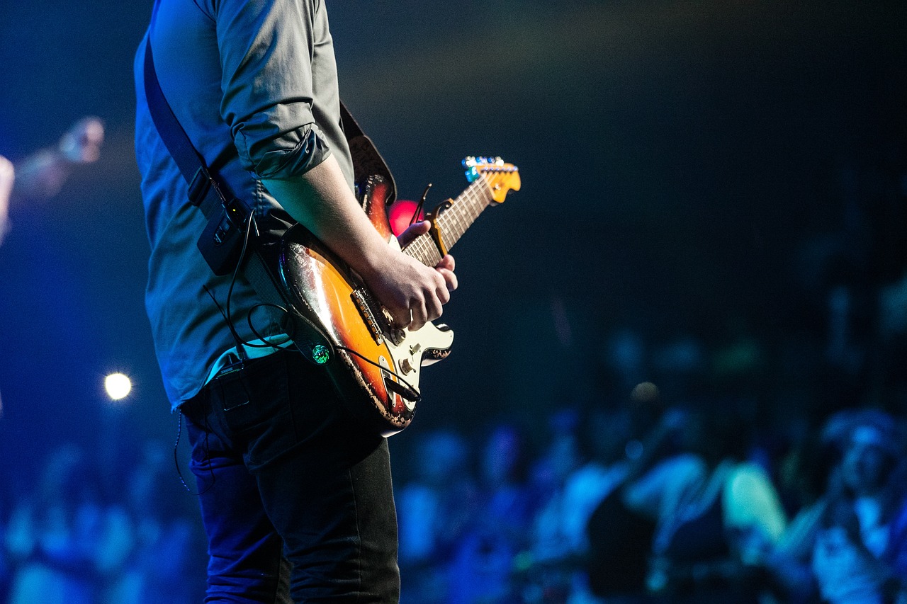 A guitarist playing music for an audience