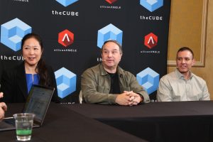 Julia Chen, VP of Partner Core at AWS, Robert Occhialini, CTO of the World Surf League, Gabriel Romero, CMO of AllCloud, discuss the new surfing smart watch with theCUBE's John Furrier at AWS reInvent 2025.